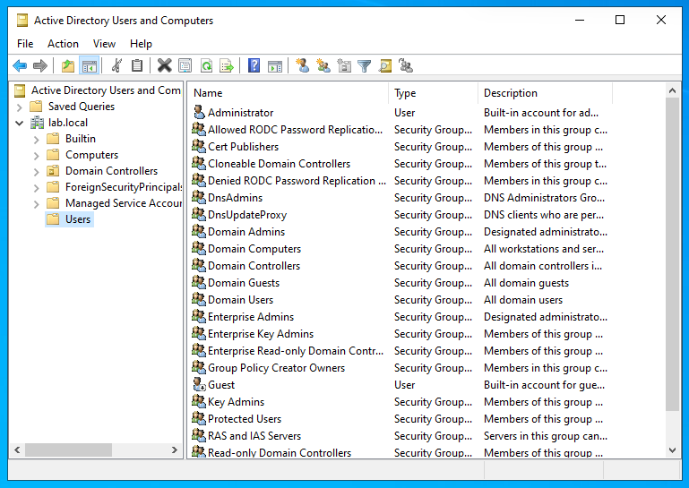 Active Directory Users and Computers showing a fresh domain structure